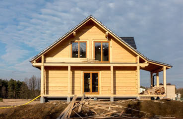 Fototapeta na wymiar building a house with wooden logs,