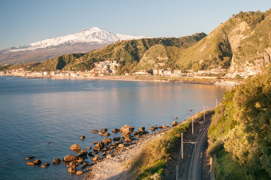 View of the touristic village Giardini Naxos, Eastsicily, in the early morning with a view of Mount Etna