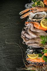 Seafood served on black stone