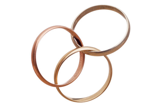 Three interlocking wedding rings. Modern marriage? Bigamy?