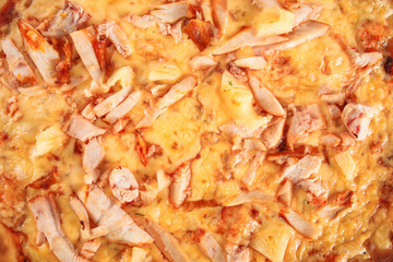 Pizza with ham, chicken and pineapple isolated on white