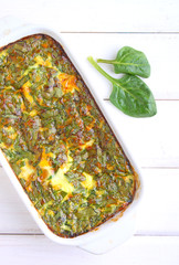 baked omelette with spinach in a white rectangular shape