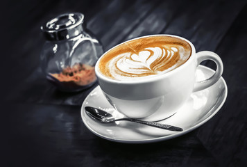 hot latte cup in the dark