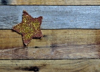 Twinkle and glittering star on pallet wood background