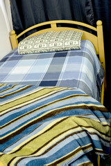 Fototapeta premium Two dollar bill pillow on a home bead