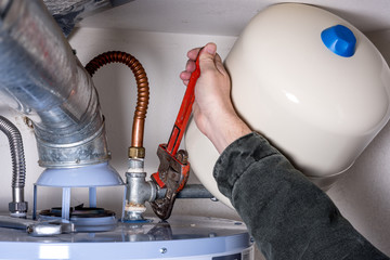 Tightening a pipe on a water heater