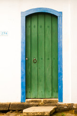 Typical historical colourful wood doors in the colonial downtown of Paraty, Rio de Janeiro, Brazil.