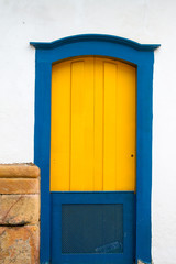 Typical historical colourful wood doors in the colonial downtown of Paraty, Rio de Janeiro, Brazil.
