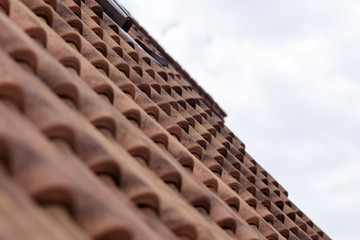 Naklejka premium Roof tiles surface against the sky