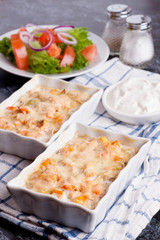 fish gratin with cream, cheese and pumpkin. French dish julienne