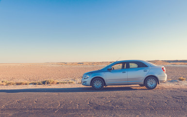 Car on road in prairie