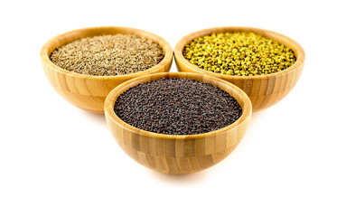 Studio isolated shot of bowls of spices, mustard in forground