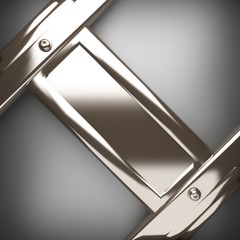 polished metal element on gray background