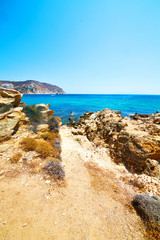 Fototapeta na wymiar in greece the mykonos island rock sea and beach blue sky
