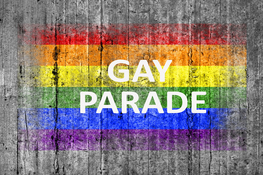 Gay Parade and LGBT flag painted on background texture gray concrete