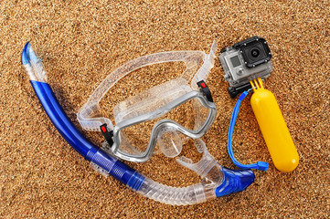 Scuba mask and snorkel on the sand.