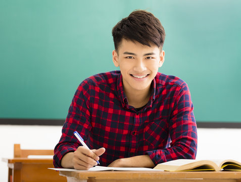 smiling  college student study in university classroom