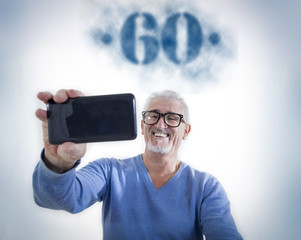 happy man takes a selfie at his sixtieth birthday