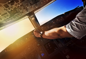 Airliner pilot at work - view from the cockpit - obrazy, fototapety, plakaty