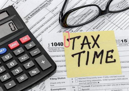 tax form with callculator and glasses