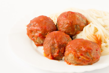 Pasta and meatballs  with tomato sauce on the white background