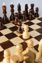 Black and white pawns facing each other
