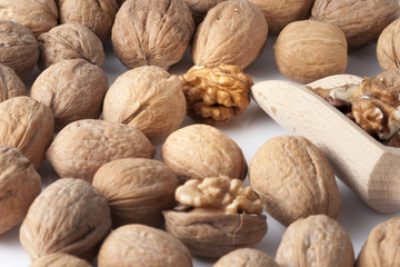 pile of walnuts in the foreground represent a healthy diet