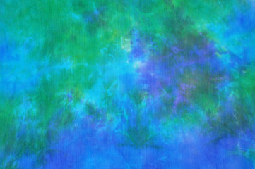 Beautiful blue and green tie dye silk fabric background