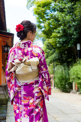 Fototapeta na wymiar The rear view of woman wearing japanese kimono