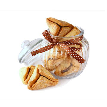 Purim celebration cookies (jewish carnival holiday). selective focus. isolated on white