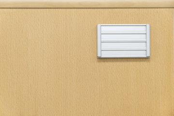 wooden surface of a file cabinet with a blank name plate