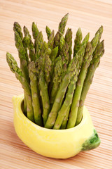 Fresh Asparagus in Lemon Bowl – A bunch of fresh asparagus in a bowl shaped like a lemon.