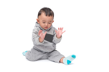 Asian baby in gray jacket, isolated on white background