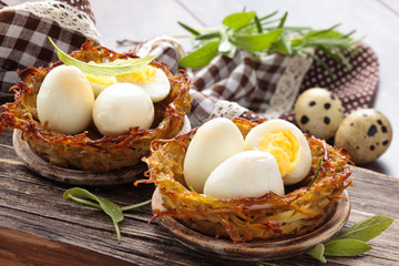 Boiled eggs in nests.