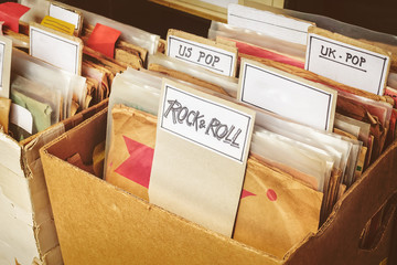 Retro styled image of boxes with vinyl turntable records