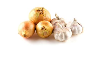 Raw whole onions and garlics on white
