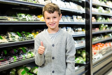 Cute boy with thumbs up