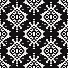 Vector grunge monochrome seamless decorative ethnic pattern. American indian motifs. Background with aztec tribal ornament. Boho style.