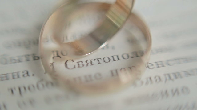 wedding rings on a book page.