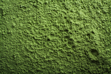 Green power background. Wallpaper of barley grass powder.