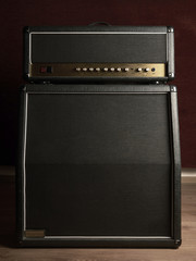 Shot of the front of an old combo guitar amplifier with speaker cabinet