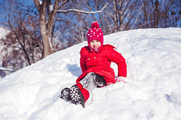 Fototapeta na wymiar Winter photo of the girl on a snowy mountain