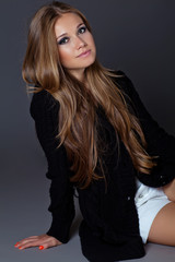 Naklejka premium portrait of beautiful woman in a black sweater 