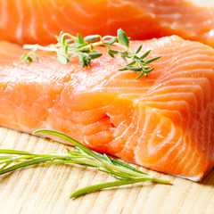 Raw salmon on cutting board