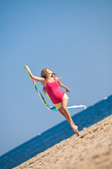 Pregnant woman are walking on the beach  