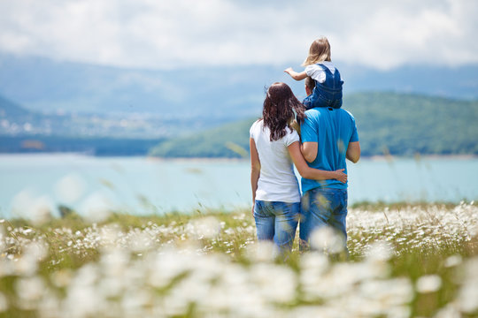 Happy Family In A Camomile Field 