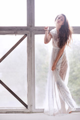 Young ballet dancer - Harmonious pretty woman posing in studio