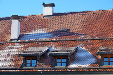 The ice on the roof of the brick house