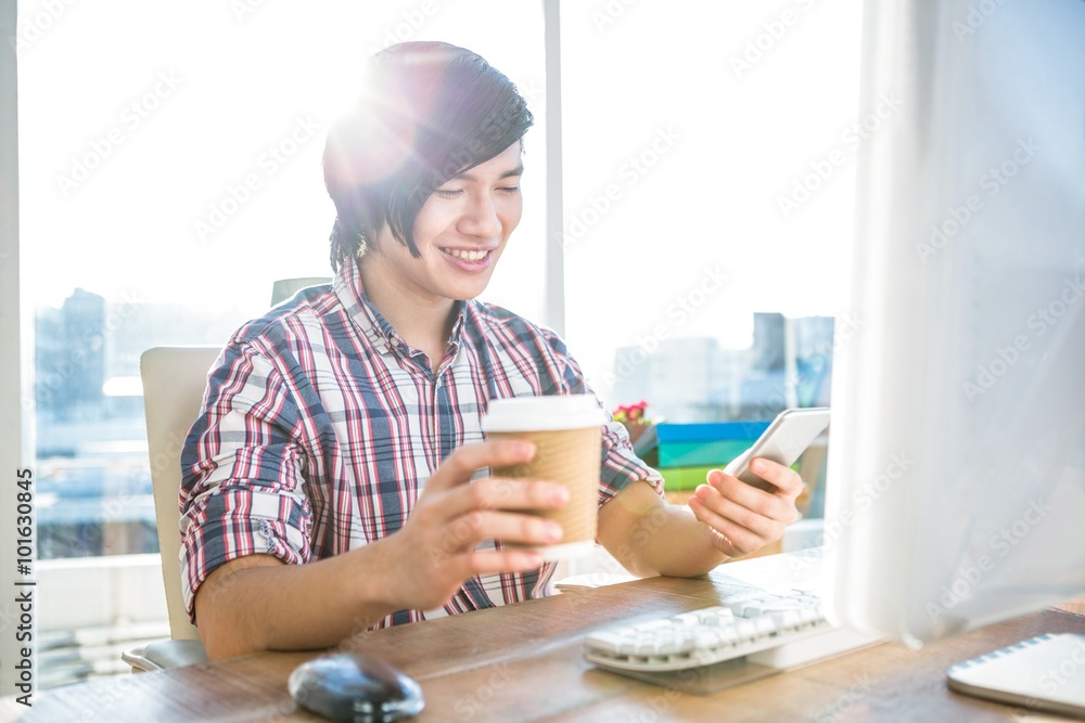 Poster smiling hipster businessman using smartphone