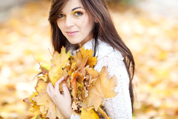 beautiful woman in autumn forest 